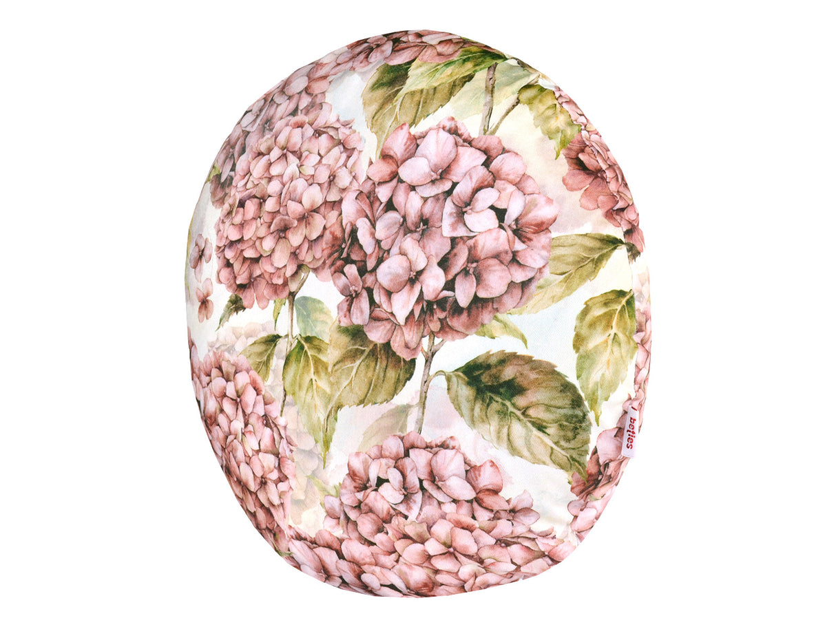 Runder Kissenbezug im Landhausstil, bedruckt mit rosa/pinken Hortensien-Blueten.