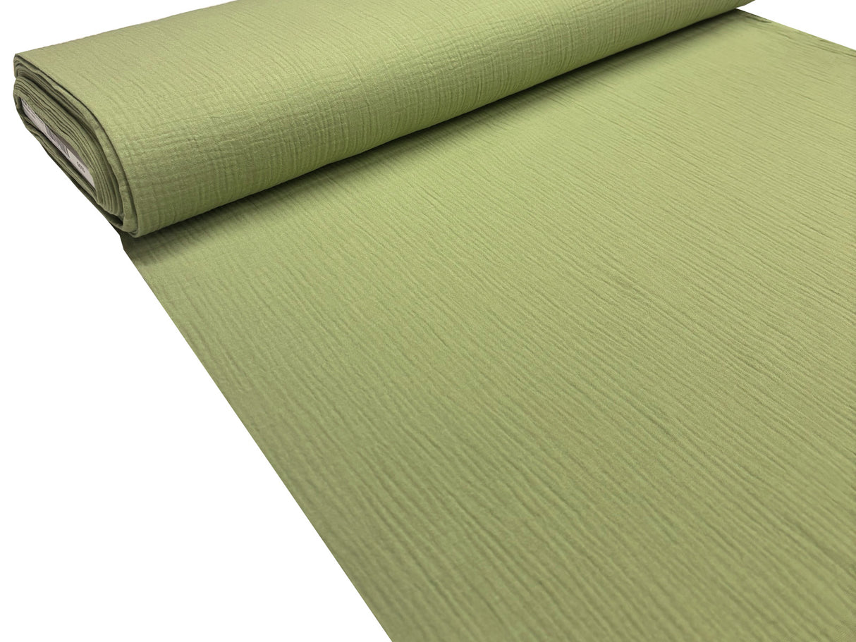 Musselin Stoffrolle in grün.