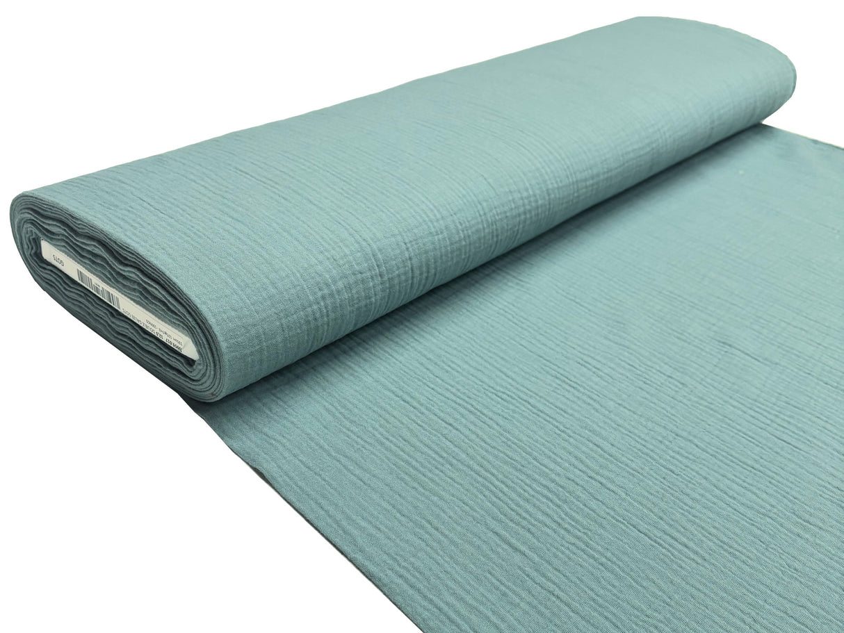 Musselin Stoffrolle in türkis.
